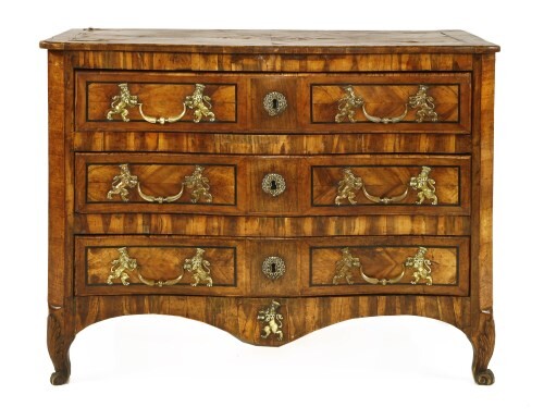 A North European olivewood serpentine commode chest