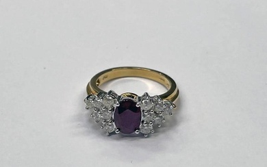 18CT GOLD RUBY & DIAMOND CLUSTER RING, THE OVAL RUBY SET WIT...
