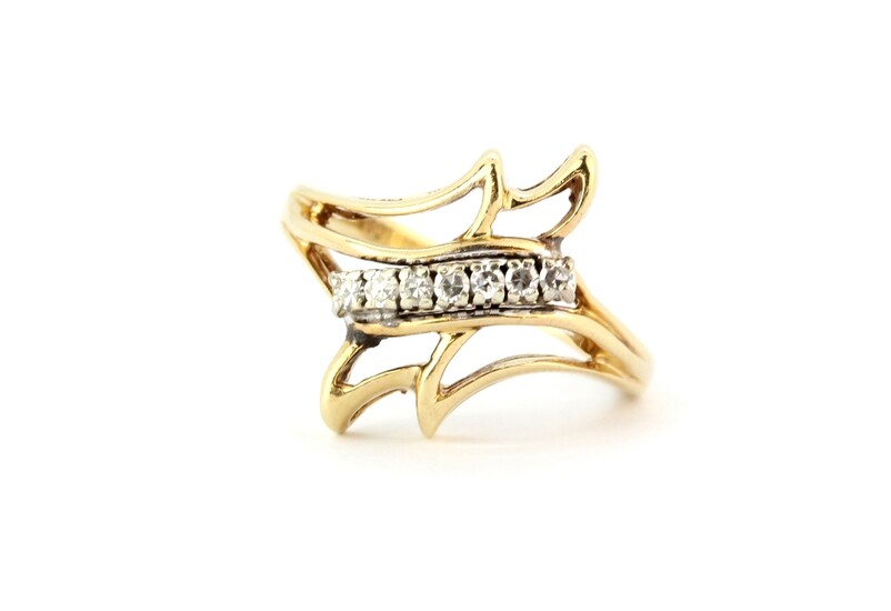 A 14ct yellow gold (stamped 585) diamond set ring, (N).