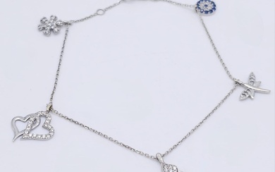 A 14kt White Gold Diamond Set Charm Bracelet. Variety...