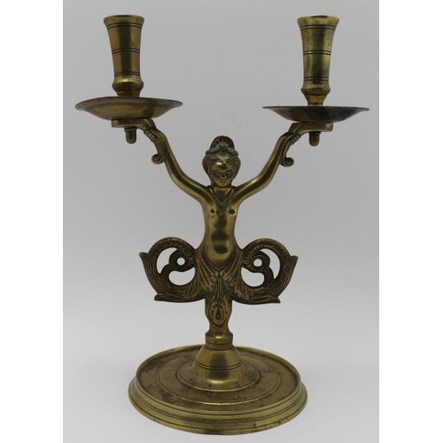 A 19TH CENTURY DUTCH BRASS CANDLE HOLDER, twin sconces held ...