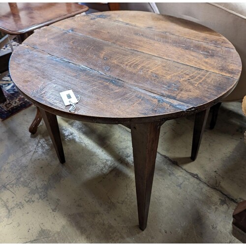A 19th century circular oak tea table, diameter 82cm, height...