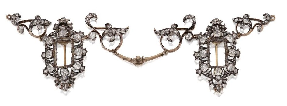 A 19th century diamond necklace fitting, comprising two old-brilliant-cut diamond panels with central stones deficient, each with detachable brooch fitting, with diamond articulated scroll panel connecting links (VAT charged on hammer price)