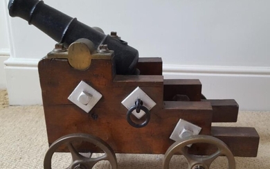 A 19thC cast iron signalling cannon mounted on stepped...