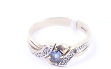 A 9ct bi-colour gold, sapphire and diamond ring cross-over ring.