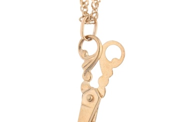 A 9ct gold novelty scissors pendant necklace, on 9ct Prince ...