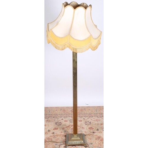 A BRASS CORINTHIAN COLUMN FLOOR STANDING LAMP with reeded co...
