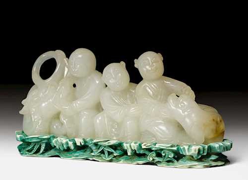 A BRUSH REST IN THE SHAPE OF THREE BOYS WITH DRAGON AND LION.