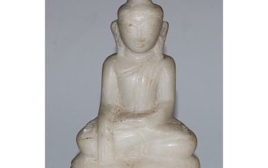 A Burmese marble Buddha, seated in Bhumisparsha mudra, lotus...