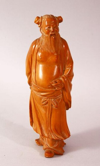 A CHINESE CARVED HARD WOOD FIGURE OF AN IMMORTAL - the