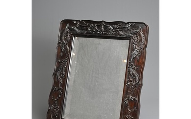 A CHINESE CARVED HARDWOOD FRAMED MIRROR, EARLY 20TH CENTURY....