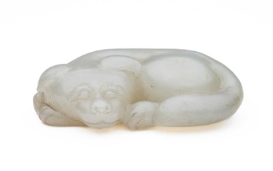 A CHINESE CELADON-WHITE JADE DOG, QING DYNASTY (1644-1911)