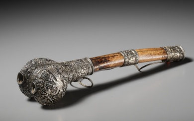 A CORAL AND TURQUOISE-INLAID SILVER-MOUNTED BONE FLUTE, KANGLING, TIBET, 19TH CENTURY