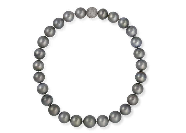 A CULTURED PEARL WITH DIAMOND CLASP Composed of...