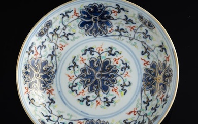 A Chinese blue and white enamel-decorated 'scrolling lotus' plate, Guangxu period, Qing dynasty