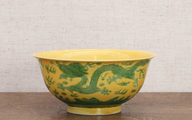A Chinese yellow-ground green-enamelled bowl