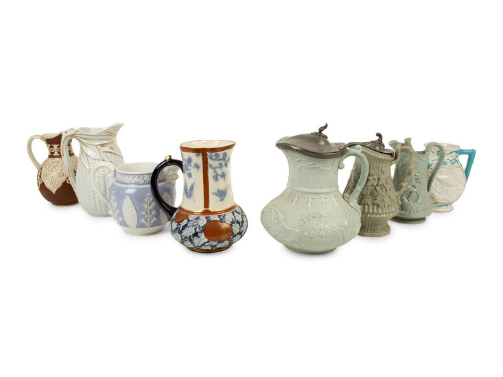 A Collection of Eight English Salt Glazed Relief Form Pitchers and Molded Earthenware