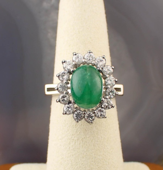 A DIAMOND AND GREEN EMERALD RING
