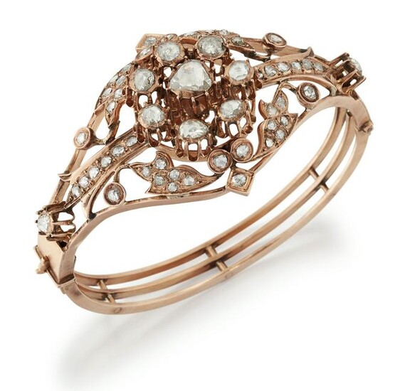 A DIAMOND BANGLE, a central cluster of rose-cut