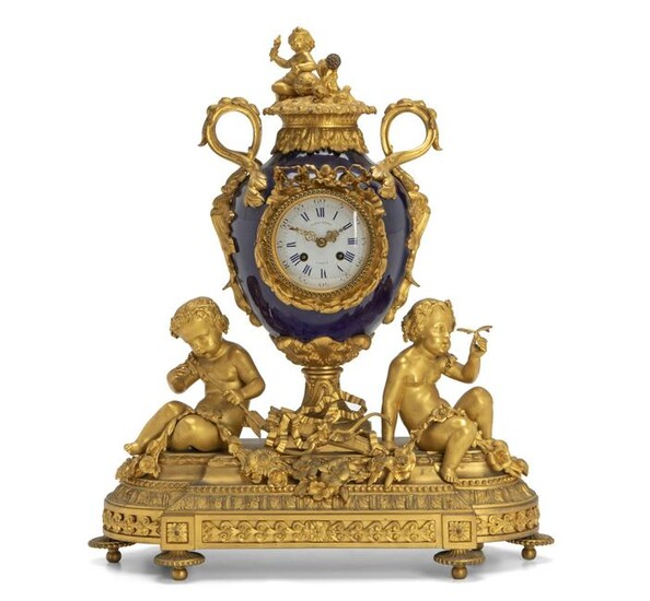 A French gilt bronze and porcelain mantle clock