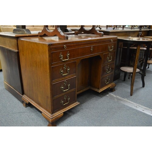 A George III design mahogany kneehole desk.