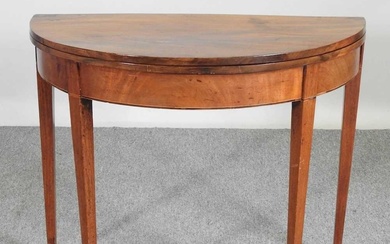 A George III mahogany D shaped folding tea table, on...