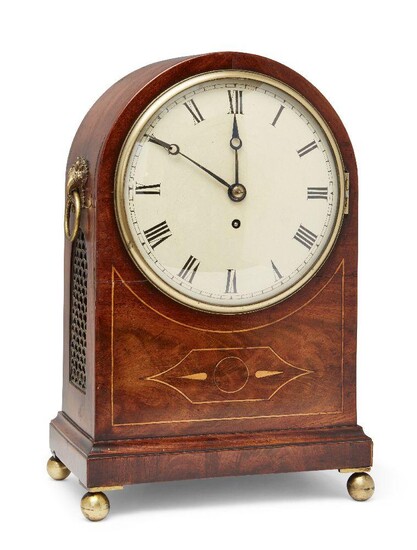 A George III mahogany and line inlaid fusee bracket clock, early 19th century, the arched mahogany case with boxwood line inlaid decoration, with twin brass cornucopia and ring handles above brass fish scale panels, on brass ball feet, the painted...