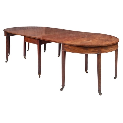 A George III mahogany extending dining table, circa 1800, wi...