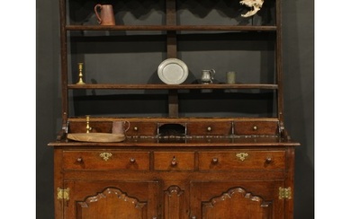 A George III oak dresser, moulded cornice above a pair of sh...