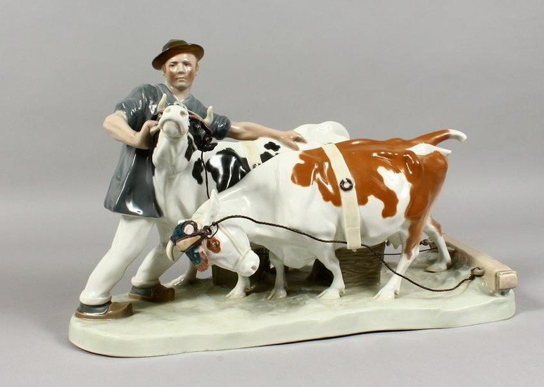 A LARGE MEISSEN PORCELAIN GROUP, farmer with two cows.