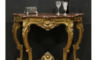 A Louis XV Revival giltwood pier table, in the Rococo taste,...