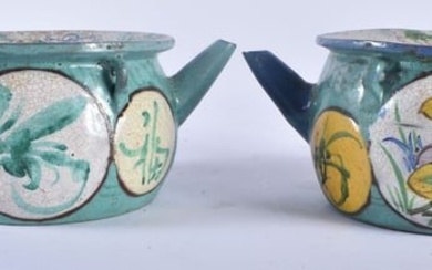 A PAIR OF 19TH CENTURY CHINESE ENAMELLED YIXING POTTERY TEAPOTS painted with flowers. 15 cm wide.