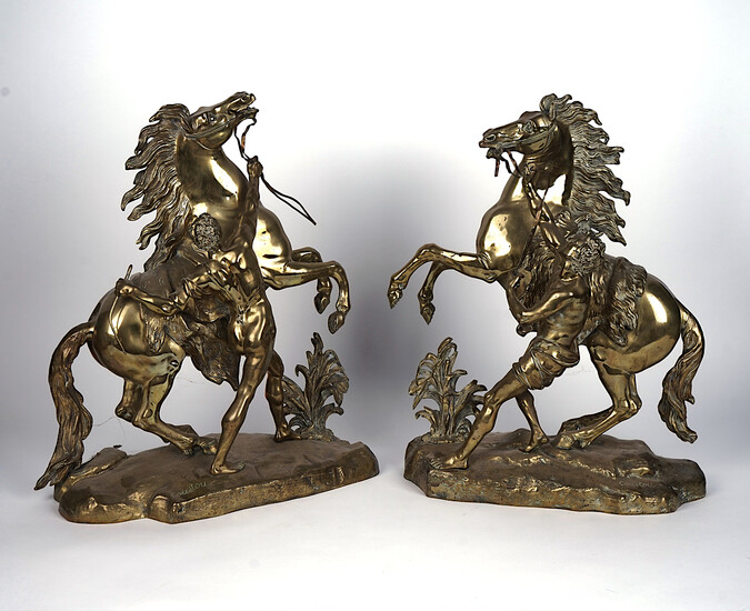 A PAIR OF POLISHED BRASS MARLY HORSES (2)
