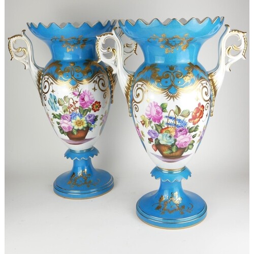 A PAIR OF SÈVRES STYLE TWIN HANDLED VASES With gilded decora...