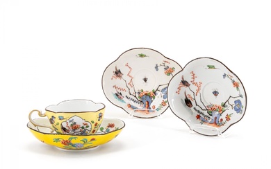 A PORCELAIN CUP AND THREE SAUCERS WITH YELLOW GROUND AND...