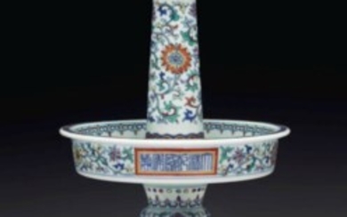 A RARE DOUCAI CANDLESTICK, QIANLONG SIX-CHARACTER MARK IN UNDERGLAZE BLUE IN A LINE WITHIN A PANEL AND OF THE PERIOD (1736-1795)