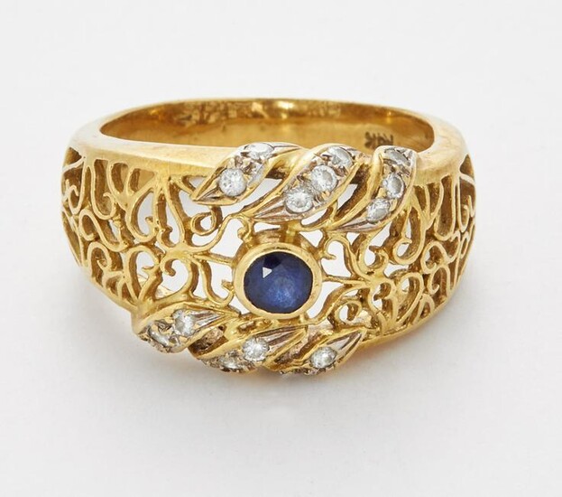 A SAPPHIRE AND DIAMOND RING, a round-cut sapphire in a
