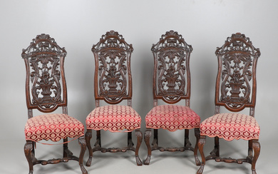 A SET OF FOUR CARVED CONTINENTAL CHAIRS.