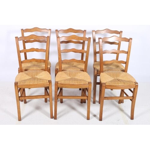 A SET OF SIX BEECHWOOD AND RUSH SEAT CHAIRS each with ladder...
