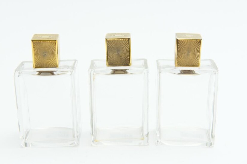 A SET OF THREE ART DECO GILT METAL TOPPED PERFUME COLOGNE BOTTLES, 10 CM HIGH, LEONARD JOEL LOCAL DELIVERY SIZE: SMALL