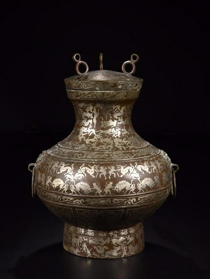 A SILVER-INLAID BRONZE HUNTER AND PREY PATTERN BOTTLE