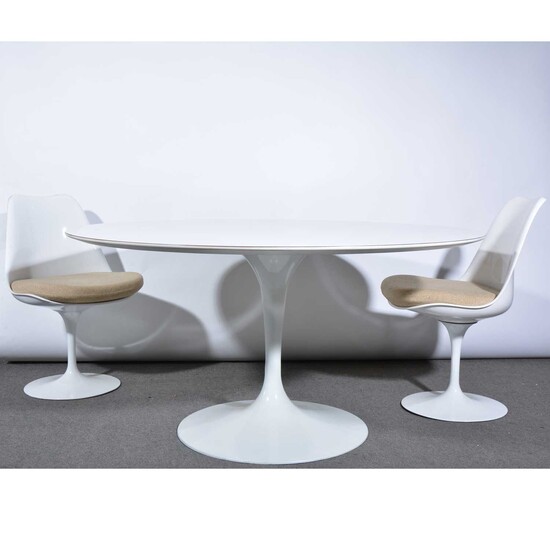 A 'Tulip' dining table and eight chairs, designed by Eero Saarinen