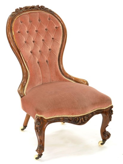 A VICTORIAN CARVED WALNUT NURSING CHAIR, UPHOLSTERED IN BUTT...
