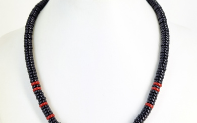 A VINTAGE BLACK AND RED MEDITERRANEAN CORAL DISC BEAD NECKLACE