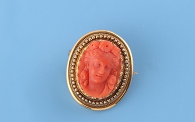 A Victorian unmarked high carat yellow gold carved coral ova...
