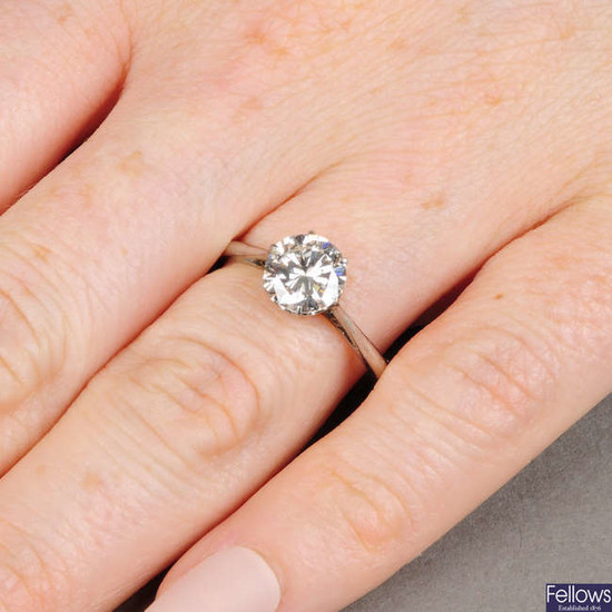 A brilliant-cut diamond single-stone ring. Estimated