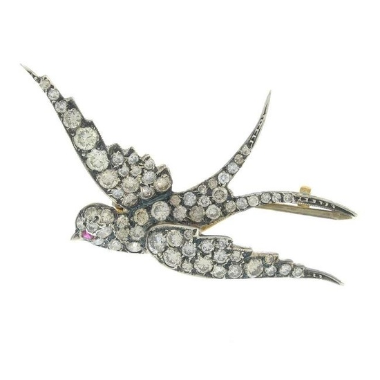 A brilliant-cut diamond swallow brooch, with ruby eye