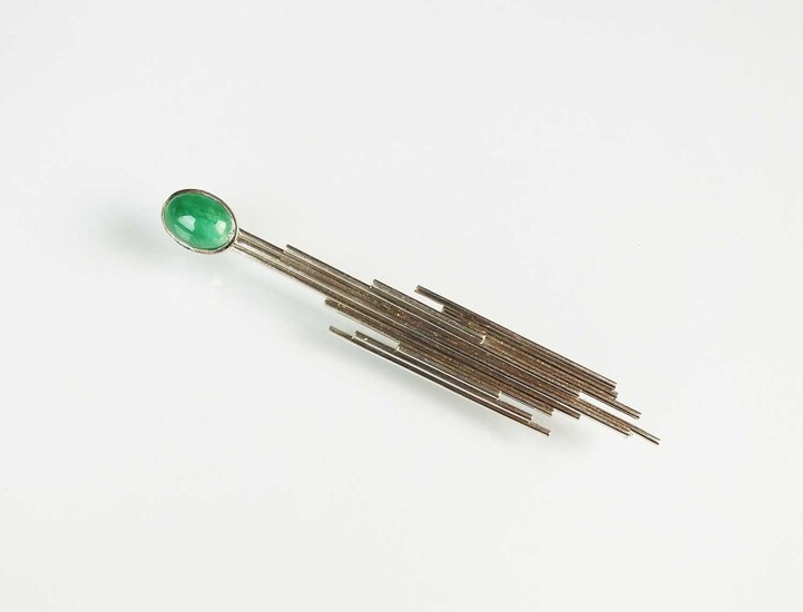 A cabochon emerald brooch of abstract design