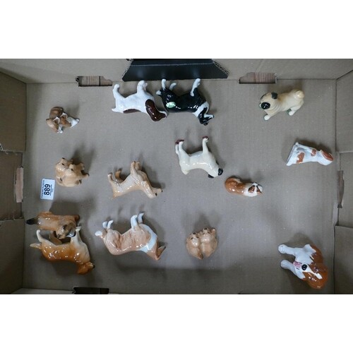A collection of small Beswick dogs: with Royal Doulton k dog...