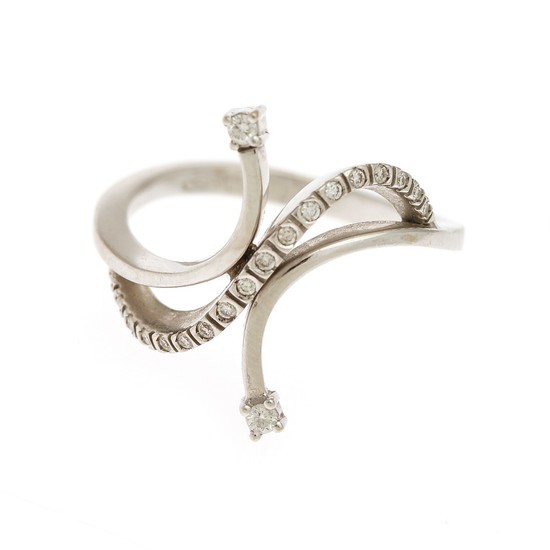 A diamond ring set with numerous brilliant-cut diamonds, mounted in 18k white gold. Size 56.